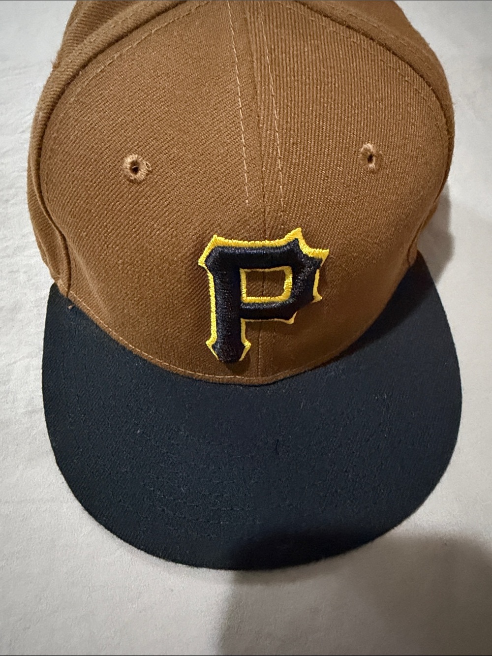 Brown and Black Baseball Cap with Yellow-Outlined 'P' Patch